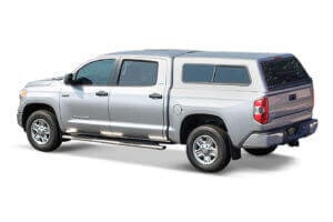 Silver toyota tundra with a Jason truck cap